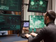 Le ransomware : cette cybermenace qui prend les entreprises en otage Young hacker making a dangerous virus for cyber attacks